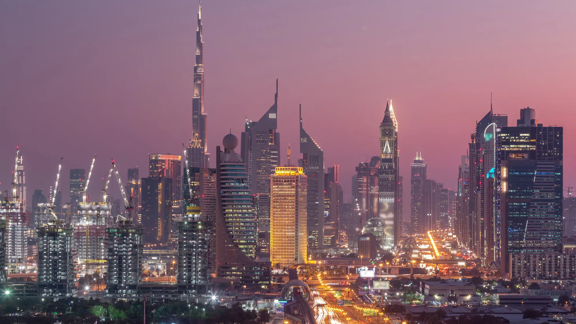 Dubai skyline at dusk with Burj Khalifa and city lights, representing the UAE as a growing global tech hub