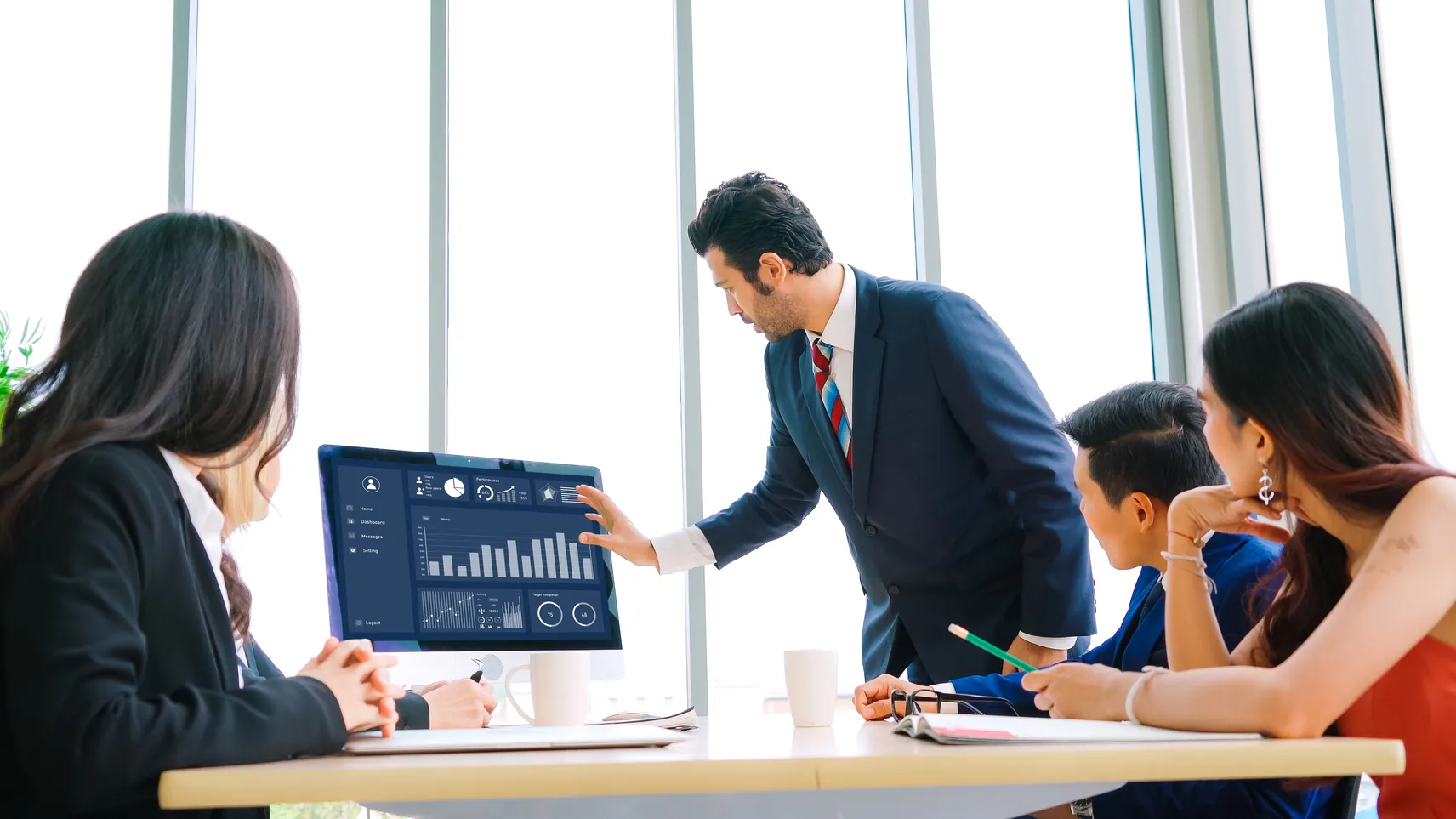 Executives reviewing financial data dashboard representing the cost of a bad hire